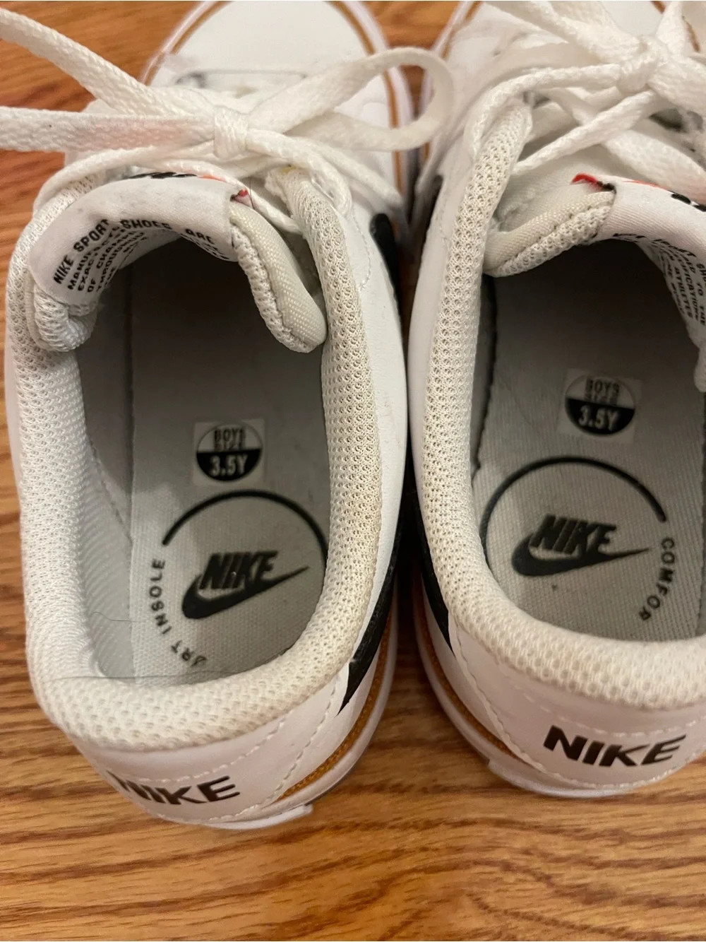 Nike Court Legacy White Low-Top Sneakers with Black Swoosh and Gold Trim